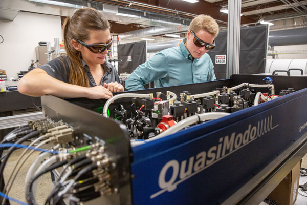 Two research students working on QuasiModol