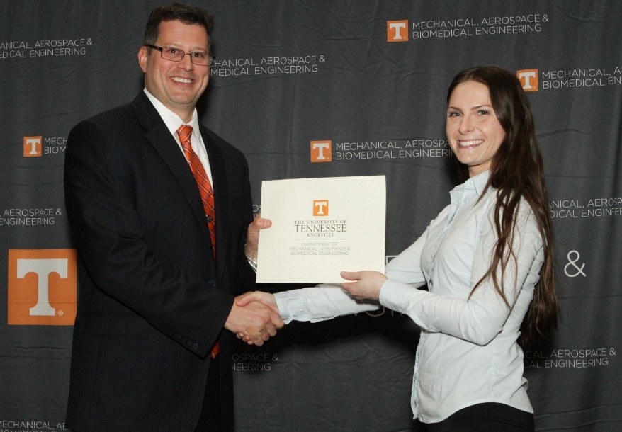 Julie King accepting her award from MABE Department Head, Matthew Mench